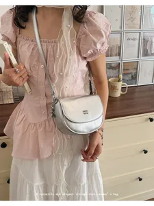 Versatile silver saddle crossbody bag with elegant vintage design for women daily wear.