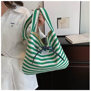 Green and white striped canvas shoulder bag for women, casual commuter daily handbag.