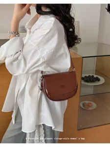 Trendy vintage brown leather shoulder bag for women, chic saddle crossbody mini handbag.