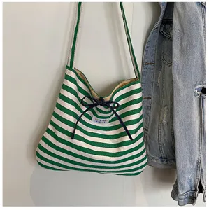 Green white striped casual canvas shoulder bag, stylish bow knot decor, large capacity design.