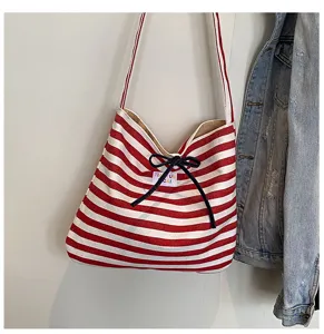 Red and white striped canvas shoulder bag with bow, casual large capacity commuter crossbody bag.