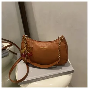 Brown PU leather shoulder bag for women with cherry charm and chain strap casual crossbody.