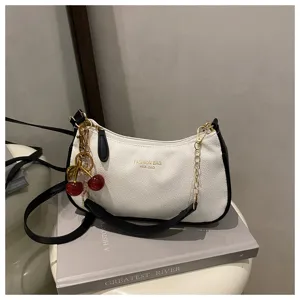 Chic white and black shoulder bag with gold chain and cute cherry charm for women stylish daily use