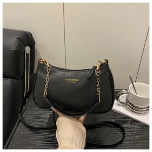 Stylish black shoulder bag for women, chic PU leather crossbody bag with trendy gold chains.
