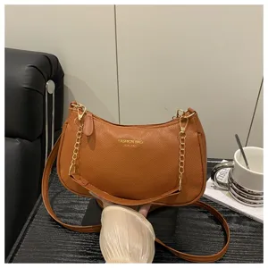 Stylish brown leather shoulder bag with chain strap, casual crossbody design for women.