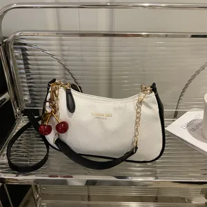 White leather hobo shoulder bag with black trim gold chain and cute cherry charm for women