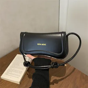 Stylish minimalist black underarm shoulder bag for women, chic commuting fashion daily handbag.