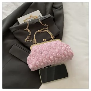 Mini pink floral evening bag detail, elegant gold metal frame chain handbag for women.
