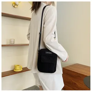 Trendy corduroy crossbody bag for women, simple casual small shoulder bag for daily use.