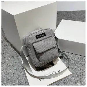 Fashion grey corduroy crossbody bag for women, minimalist casual shoulder bag with front pocket.