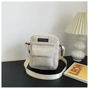 Corduroy crossbody bag for women, minimalist solid color small messenger bag with pocket.