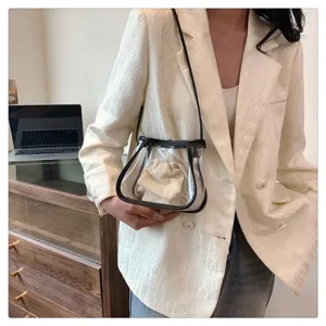 Clear transparent jelly crossbody shoulder bag with inner pouch, detail view of summer fashion.