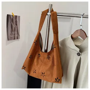 Brown suede hobo tote bag for women, large capacity shoulder bag with chic floral cutouts.