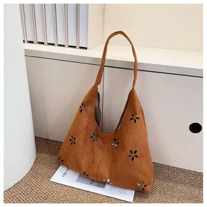 Large capacity brown suede tote bag with stylish hollow flower pattern for daily commuting.