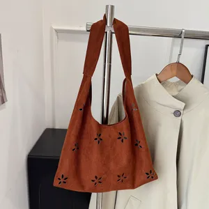 Large capacity suede tote bag with hollow flower design, casual shoulder and crossbody bag for women.