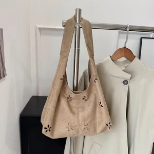 Chic suede tote bag for women, large capacity shoulder hobo bag with trendy floral cutout design.