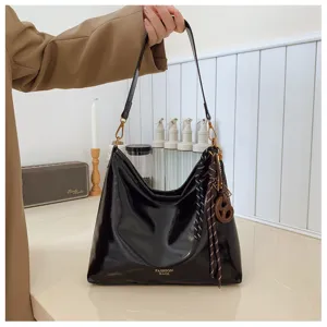 Black patent leather shoulder bag for women, retro casual bucket bag with scarf decor.