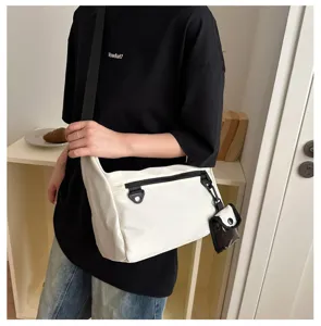 Japanese minimalist nylon messenger bag, trendy casual crossbody bag for outdoor daily use.
