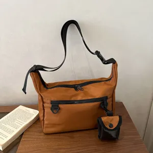 Minimalist nylon messenger bag, casual crossbody shoulder bag for women daily outdoor use.