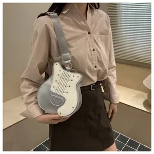 Detailed view of the creative guitar shaped crossbody bag with contrast color and cool rivets.