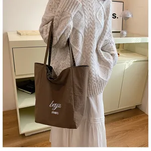 Brown canvas tote bag with leopard print lining, casual shoulder bag for daily use and school style.