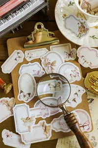 Detailed view of vintage butterfly label sticker pack, perfect for DIY journaling and scrapbooking.
