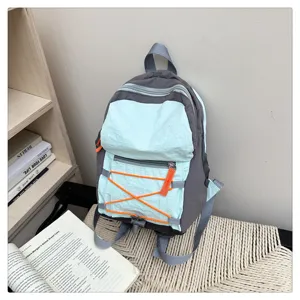 Stylish casual mini backpack in grey and mint green with orange cords for daily travel.