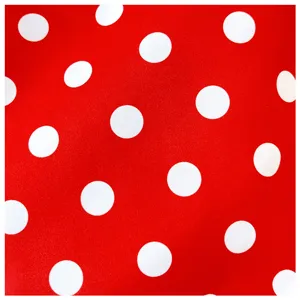 Red white polka dot nylon fabric detail texture showcasing trendy lightweight everyday commuter bag.
