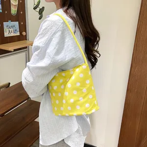 Yellow polka dot shoulder bag, casual nylon underarm bag for women daily commute style.