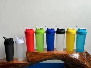 Detailed view of colorful plastic fitness shaker cups with leak-proof lids for gym workouts.
