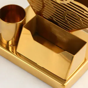 Gouden metalen bureau organizer set met penhouder, kaarthouder en servethouder voor tafel.
