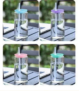 Detailed view of clear glass cup with colorful lid and straw, perfect for daily office use.