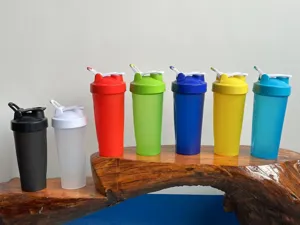 Fitness shaker bottle protein mixer cup with leakproof lid and portable handle for sports.
