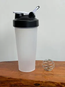 Fitness shaker bottle with mixing ball, leakproof protein gym cup for sports and health shakes.