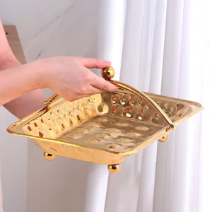 Gouden Roestvrijstalen Gehamerde Fruitmand met Handvat Creatieve Snackmand voor Tafel