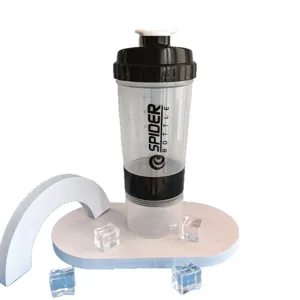 Transparent fitness protein shaker bottle with powder compartment, multi-layer gym mixing cup.