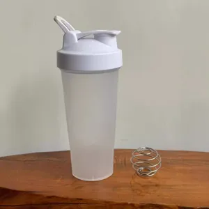 Portable fitness protein shaker bottle with mixing ball and leak-proof lid for sports gym.