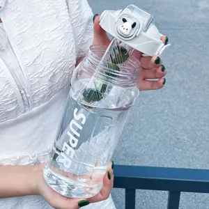 Detailed view of the large capacity sports water bottle with cute cartoon lid design.