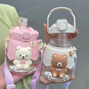 Cute cartoon bear large capacity water bottle with strap, straw cup for students and kids.