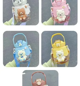 Cute cartoon bear large capacity water bottle with strap, straw, and big belly design.