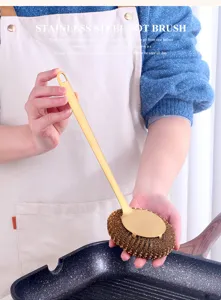 Stainless steel pot brush detail view showing ergonomic long handle and durable metal cleaning ball.