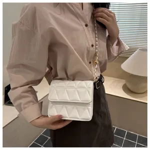White quilted cross-body chain bag detail, elegant fashion style for daily wear.