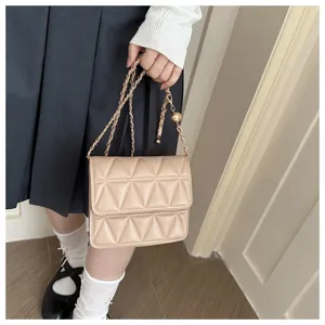Beige quilted shoulder bag for women, chic crossbody bag with chain strap and metal ball.