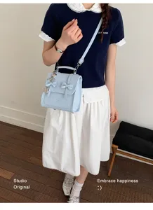 Zaino mini azzurro chiaro con fiocco vista dettaglio, borsa giornaliera in pelle PU chic.