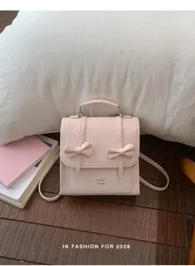 Zaino rosa chic con graziosi fiocchi, elegante borsa casual da donna per il vostro lavoro.