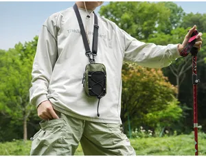 Outdoor tactical chest bag detail showing grid fabric and stretch pocket for hiking.