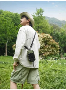 Outdoor lifestyle detail shot showcasing the compact grid crossbody chest bag worn in nature.