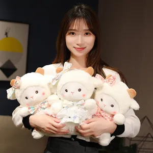 Cute little sheep plush toy detail, soft stuffed animal doll with bow dress birthday gift.