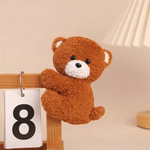 Cute brown plush bear clip toy, soft hanging doll for desk decor and cozy companion.