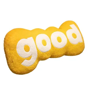 Yellow plush long pillow with white letters, cute sofa cushion and soft decorative toy for home.